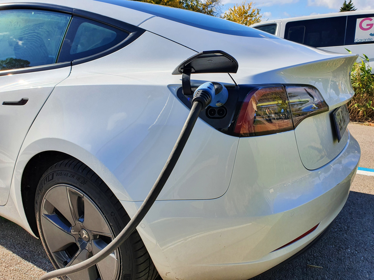 Charging stations and portable chargers for Tesla vehicles